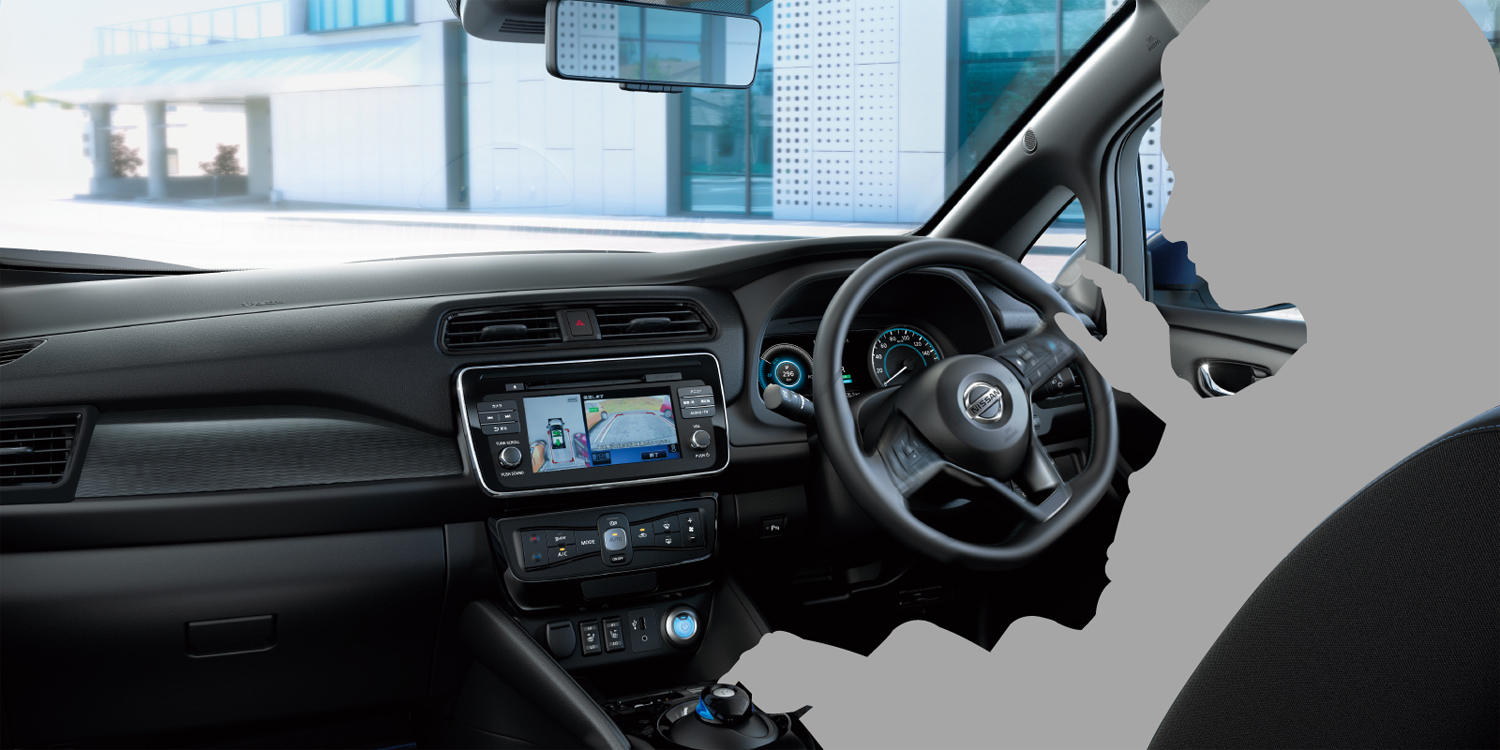 Nissan LEAF shown from the rear driving on a desert highway